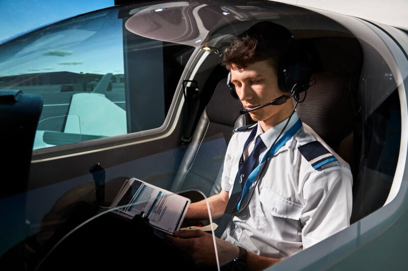 Skyborne student in cockpit of training aircraft