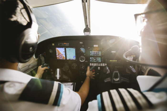 Instructor and student in the cockpit during a flight lesson