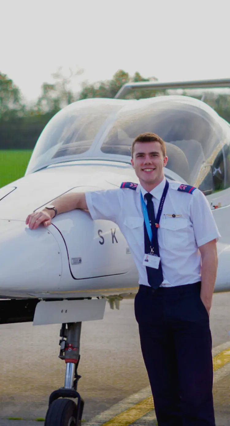 Skyborne student Jack in front of training airplane
