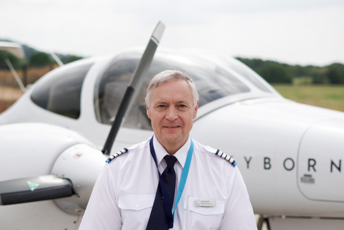 Tedd Pinkney in front of a training plane