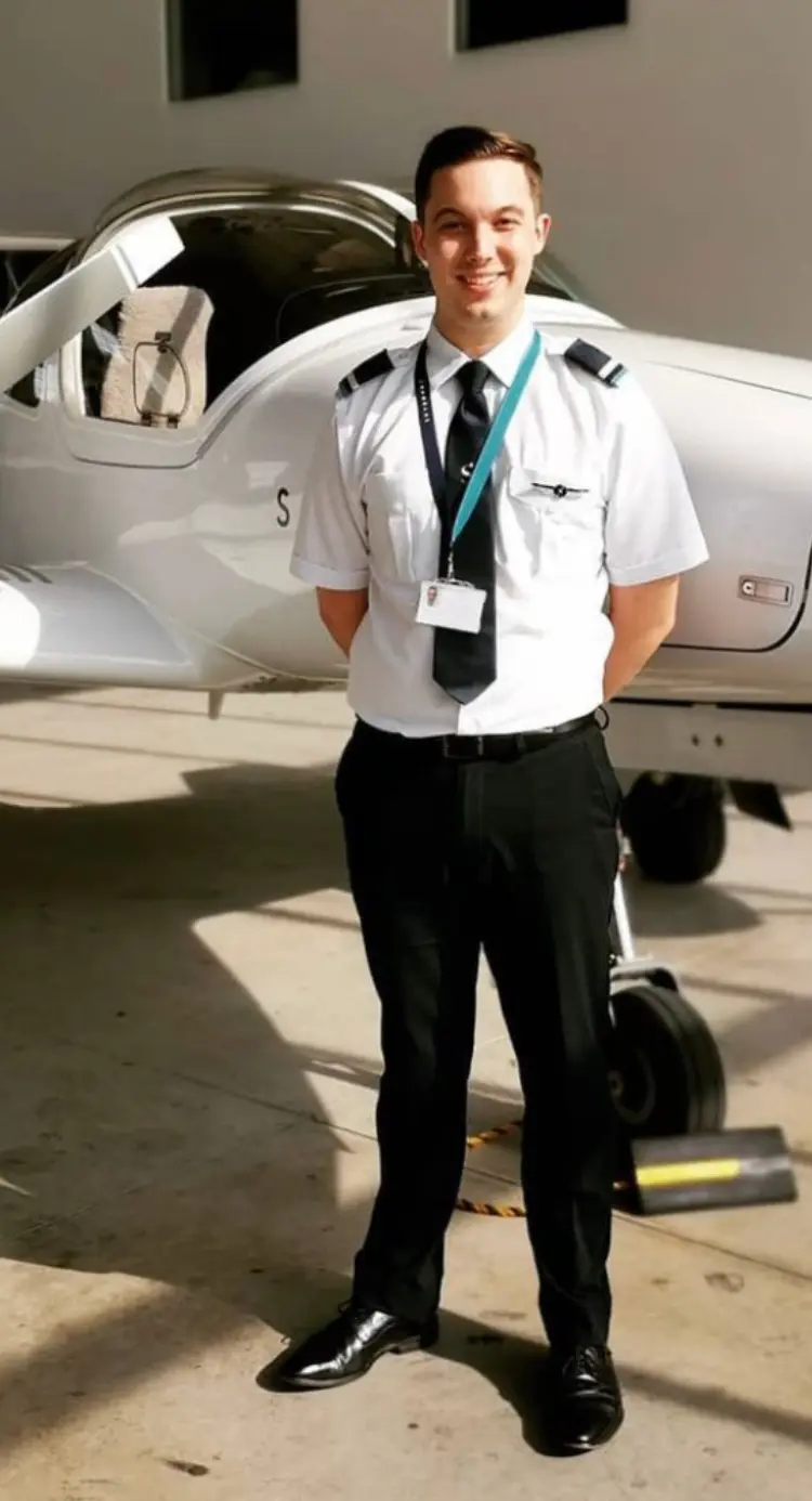 Nick Smith in front of training airplane