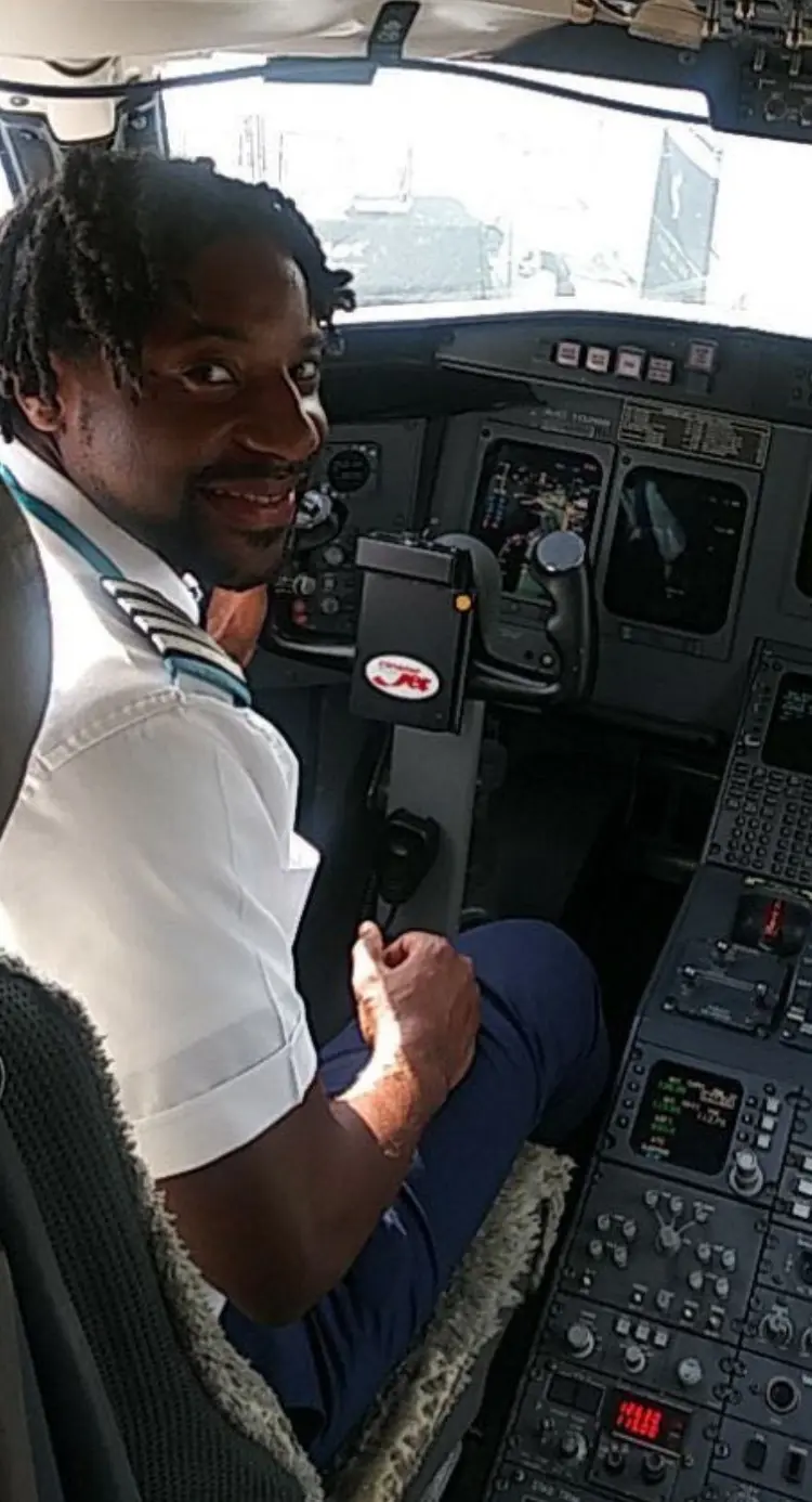 Olawale in an airplane cockpit